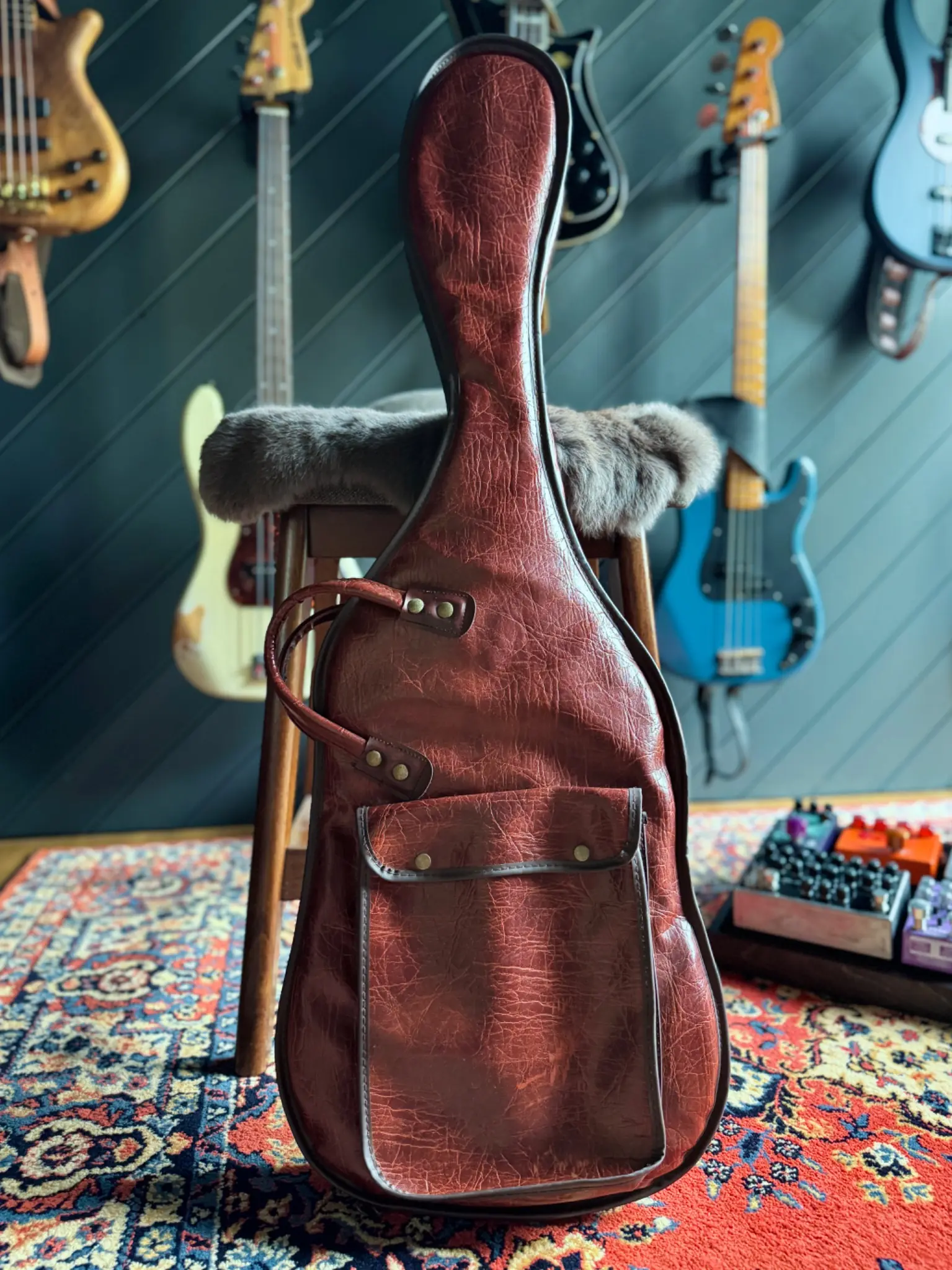 John K.’s vintage bass gig bag in the Chamber, with basses in the background