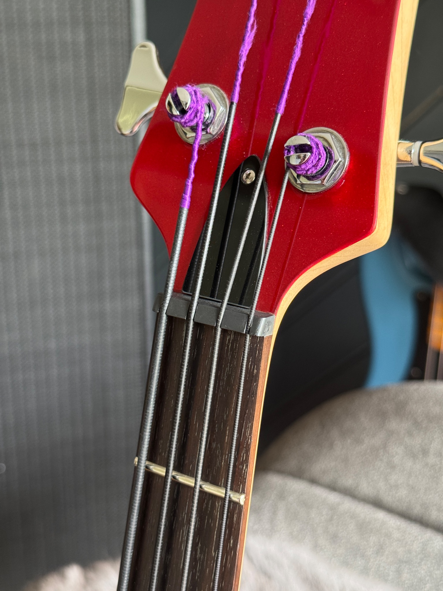 Angled view of the headstock, strings and tuners