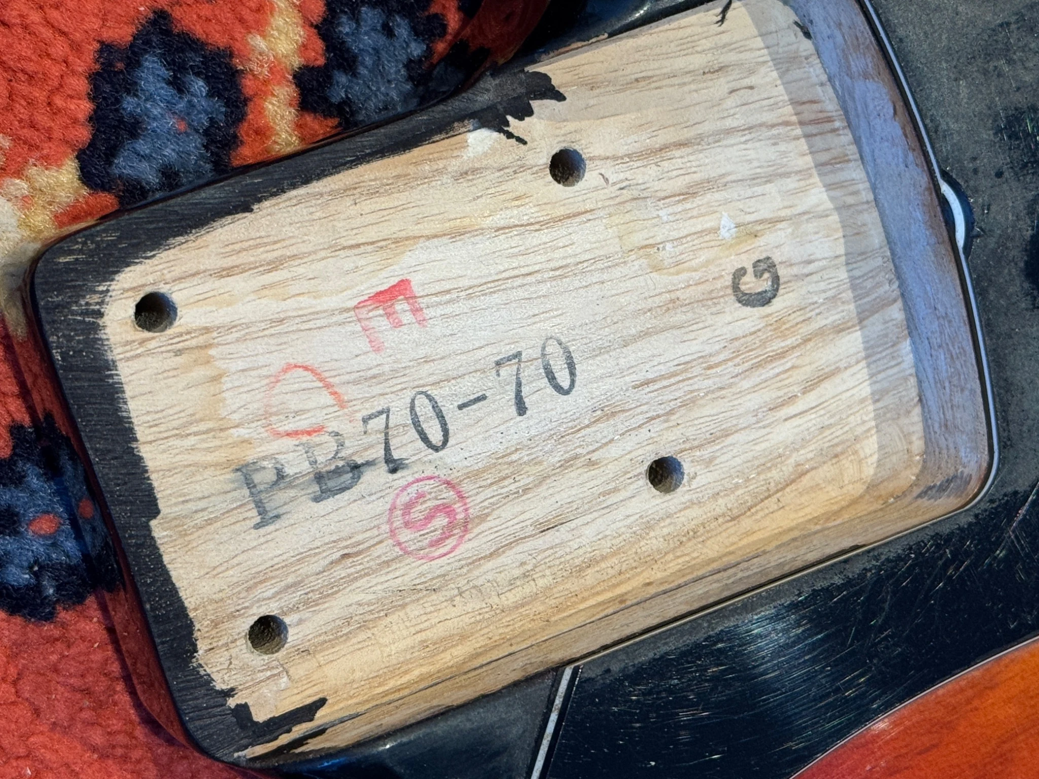 Handwritten date and inspection marks on wood